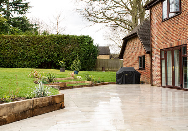 Looking along the rear of the dwelling showing new sleeper ending and stepping up to the lawn