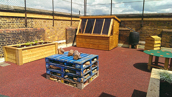 New roof-garden potting shed with insect house in foreground