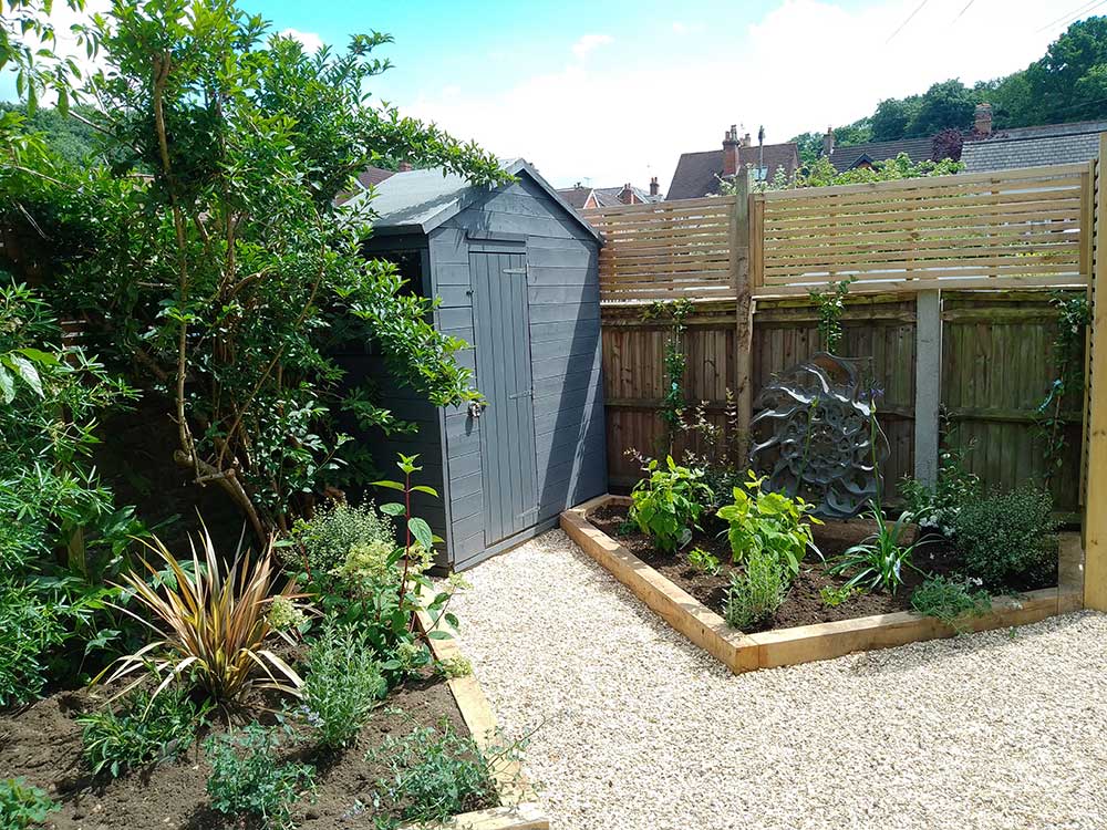 Gravel path to garden shed and new planting